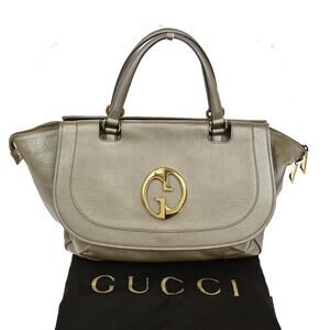 Gucci Leather 1973 Top Handle Bag Gold